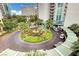 Beautiful circular driveway with manicured landscaping and covered entrance for a luxury condo building at 222 Karen Ave # 705, Las Vegas, NV 89109