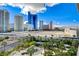 Rooftop garden view with a table and chairs surrounded by green landscaping in front of city buildings at 222 Karen Ave # 705, Las Vegas, NV 89109