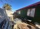 A partially xeriscaped backyard featuring assorted outdoor furniture and block wall providing privacy at 2408 Canosa Ave, Las Vegas, NV 89104