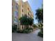 Luxury condo building with attractive landscaping and mountain views at 29 Montelago Blvd # 309, Henderson, NV 89011
