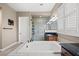 Bathroom with double sinks, soaking tub, and walk-in shower at 2920 Josephine Dr, Henderson, NV 89044