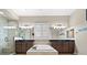 Spa-like bathroom with double sinks, large soaking tub, and glass shower at 2920 Josephine Dr, Henderson, NV 89044