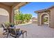 Spacious courtyard entry with seating area, mature trees, and gated access at 2920 Josephine Dr, Henderson, NV 89044