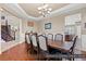 Formal dining room with hardwood floors, chandelier and kitchen views at 2920 Josephine Dr, Henderson, NV 89044