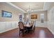 Formal dining room with hardwood floors, chandelier, and wainscoting at 2920 Josephine Dr, Henderson, NV 89044