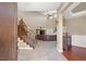 Bright entryway with hardwood floors, staircase, and views to living area at 2920 Josephine Dr, Henderson, NV 89044