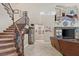 The foyer features a staircase, tile floors, TV, and entry to a downstairs primary suite at 2920 Josephine Dr, Henderson, NV 89044