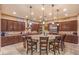 Bright kitchen features a large island with barstool seating, granite countertops and stainless steel appliances at 2920 Josephine Dr, Henderson, NV 89044