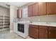 Well-organized laundry room featuring modern washer and dryer, cabinetry, and tiled floor at 2920 Josephine Dr, Henderson, NV 89044