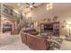 Two-story living room with a staircase and large sectional sofa at 2920 Josephine Dr, Henderson, NV 89044