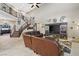 Two-story living room with a staircase and large sectional sofa at 2920 Josephine Dr, Henderson, NV 89044