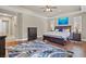 Spacious main bedroom featuring hardwood floors, a large rug, a decorative painting and comfortable furnishings at 2920 Josephine Dr, Henderson, NV 89044