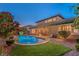 Inviting pool and patio area with lush landscaping at 2920 Josephine Dr, Henderson, NV 89044