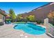 Inviting kidney-shaped pool with a water feature, surrounded by landscaping at 2920 Josephine Dr, Henderson, NV 89044