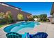Relaxing pool area with blue lounge chairs and a basketball hoop at 2920 Josephine Dr, Henderson, NV 89044