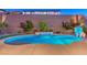 Blue illuminated pool at dusk, creating a serene backyard setting at 2920 Josephine Dr, Henderson, NV 89044