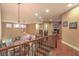 Upstairs hall with wood floors, high ceilings, and a view of the living room at 2920 Josephine Dr, Henderson, NV 89044