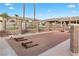 Community area with a bocce ball court, picnic table, and seating surrounded by landscaping at 3342 Pheasant Canyon Way # 1013, Laughlin, NV 89029