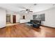 Bright living room featuring hardwood floors and a ceiling fan at 3701 Malner Ln, Las Vegas, NV 89130