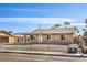 Inviting single-story home featuring a covered entrance, secure fence, and well-kept front yard, combining charm and security at 4857 E Monroe Ave, Las Vegas, NV 89110