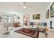 Bright living room with sofa, coffee table, and dining area at 5856 Rainbow Bridge Dr, Las Vegas, NV 89142