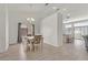 The dining area has a charming table set, elegant chandelier, and flows into the kitchen at 5915 Ablette Ave, Las Vegas, NV 89122