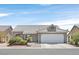 Charming single-story home with a two-car garage and low maintenance desert landscaping at 5915 Ablette Ave, Las Vegas, NV 89122