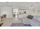 Open floor plan featuring a living room that flows into the dining and kitchen area at 5915 Ablette Ave, Las Vegas, NV 89122