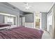 Spacious main bedroom with a king-size bed and access to the en-suite bathroom at 5915 Ablette Ave, Las Vegas, NV 89122