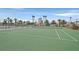 Outdoor tennis court with surrounding fence at 5915 Ablette Ave, Las Vegas, NV 89122