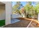 Private backyard area with low-maintenance desert landscaping and partial privacy wall at 6250 W Flamingo Rd # 98, Las Vegas, NV 89103