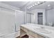 Bathroom features tub-shower combo, tile surround, vanity and large mirror at 6250 W Flamingo Rd # 98, Las Vegas, NV 89103