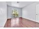 Bright bedroom featuring laminate floors and access to an outdoor balcony at 6250 W Flamingo Rd # 98, Las Vegas, NV 89103