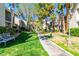 Well-maintained walkway with lush greenery and mature trees, perfect for leisurely strolls at 6250 W Flamingo Rd # 98, Las Vegas, NV 89103