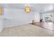 Open-concept living room features wood and tile flooring with sliding door access to a patio at 6250 W Flamingo Rd # 98, Las Vegas, NV 89103