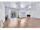 Spacious living room with a fireplace, sliding glass door, and hardwood floors at 6250 W Flamingo Rd # 98, Las Vegas, NV 89103