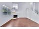 Bright living room with fireplace, window, and hardwood floors at 6250 W Flamingo Rd # 98, Las Vegas, NV 89103