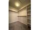 Spacious walk-in closet with shelving and hanging rods at 6250 W Flamingo Rd # 98, Las Vegas, NV 89103