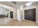 Bright entryway with double doors and hardwood flooring at 6316 W Gowan Rd, Las Vegas, NV 89108