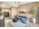 Living room with a comfortable sectional sofa and a modern coffee table at 6316 W Gowan Rd, Las Vegas, NV 89108