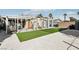 Spacious backyard features turf area, dog kennel, and privacy fencing at 6409 Youngmont Ave, Las Vegas, NV 89103