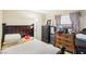 Well-lit bedroom features neutral colors and ample furnishings at 6409 Youngmont Ave, Las Vegas, NV 89103