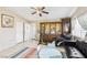 Living room with tiled floor, neutral walls, natural light, and comfortable seating at 6409 Youngmont Ave, Las Vegas, NV 89103