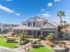 Two-story home with stone accents and landscaped yard at 6541 Ashley Vale St, Las Vegas, NV 89131