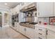 Modern kitchen with stainless steel appliances and white cabinetry at 6541 Ashley Vale St, Las Vegas, NV 89131