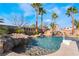 Resort-style pool with spa, waterfall, and slide at 6541 Ashley Vale St, Las Vegas, NV 89131