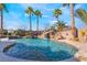 Resort-style pool with waterfall and slide, perfect for entertaining at 6541 Ashley Vale St, Las Vegas, NV 89131