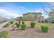 Two-story home featuring drought-resistant landscaping and a well-maintained exterior at 726 N Water St, Henderson, NV 89015