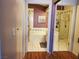 Clean bathroom with a bathtub and shower, and updated flooring at 7820 Foxwood Pl, Las Vegas, NV 89145