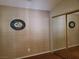 Spacious bedroom with mirrored closet doors and wood flooring at 7820 Foxwood Pl, Las Vegas, NV 89145